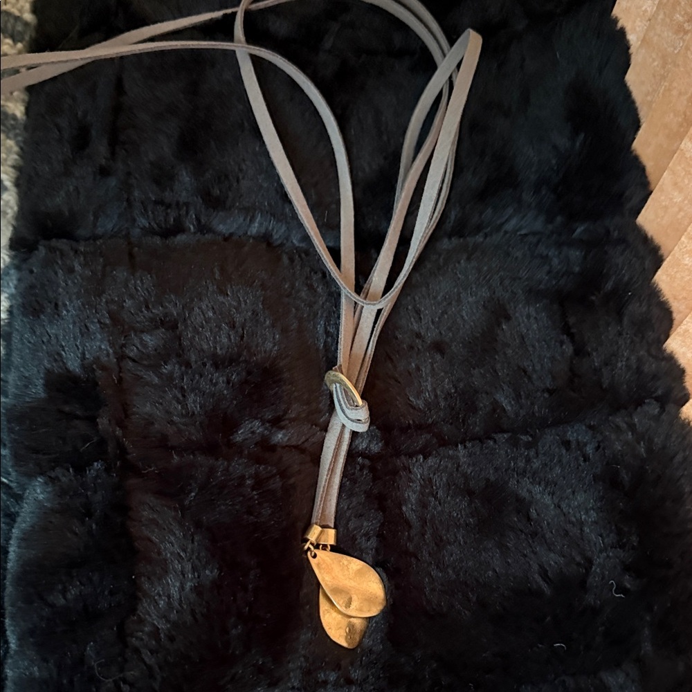 Gold Pendant on Gray Leather Necklace